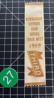 Front view of ribbon showing full gold foil text and design