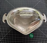 Top view of roaster with glass lid showing etched design and handles