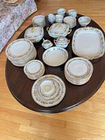Full dinnerware set displayed on table