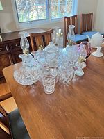 Group view of oil lamps, goblets, bowls, vases on table