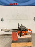 Left side view of Dolmar RS-540 chainsaw with bar cover attached