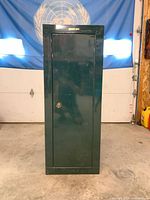 Front view of green Stack-On cabinet