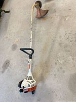 Full view of Stihl FS 38 string trimmer showing curved shaft and entire assembly