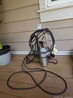 Full view of pump with coiled power cord