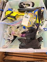 Overview of tote with masks, snorkels, vest, water shoes, mesh bag