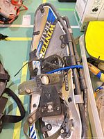 Pair of GV Winter Trail snowshoes stacked, showing bindings, frame, deck graphics