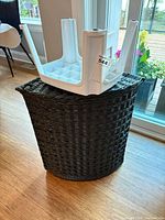 Hamper upright with inverted stool on top