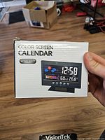 Front of boxed Model 8082T color screen calendar clock