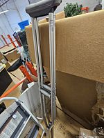 Full view of crutch pair showing overall design and adjustable holes