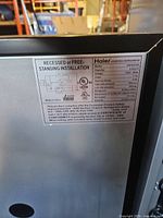 Rear information label showing model and electrical specifications