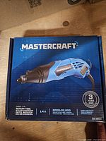 Box top showing Mastercraft rotary tool, branding, 1.4A and 8,000–32,000 RPM specs