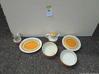 Group shot of all dinnerware pieces on ground