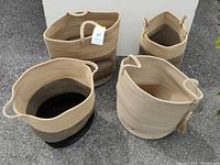 Oblique view of all four baskets showing shape, handles and color patterns