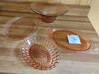 All four pink Depression glass pieces on countertop