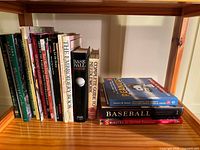Shelf view of assorted vertical and horizontal books