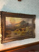 Front view of framed oil painting on wall