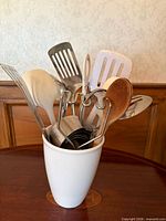Utensil holder filled with assorted utensils