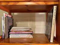 Entire shelf with vertical and horizontal stacks of books