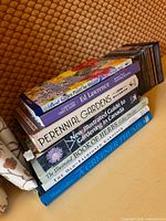 Spine view of entire stack of six gardening books