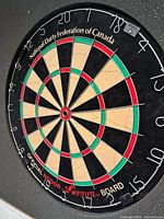 Close-up of Nodor Wiflyte dartboard showing branding and condition