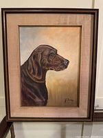 Full view of framed dog portrait painting