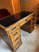 Front angled view showing full desk, black top, both pedestals with drawers