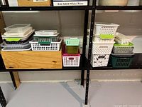 Full view of assorted plastic trays and baskets on shelves