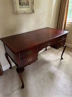 Front and top view showing overall form, drawers, cabriole legs, finish condition