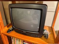 Front view of RCA CRT television on shelf