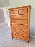 Full front view of dresser showing seven drawers and overall finish