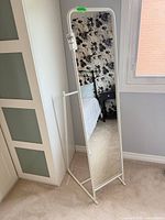 Front view of freestanding white metal cheval mirror