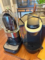 Keurig brewer and Oster blender side by side showing overall condition and accessories