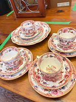 All porcelain pieces arranged showing pattern and quantity