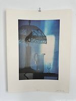 Full view of unframed lithograph hanging