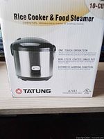 Retail box showing Tatung rice cooker model and 10-cup capacity