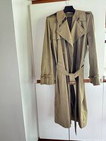 Front view of khaki Cumberland trench coat on hanger
