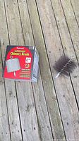 Brush and packaging on wood surface