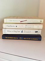 Spine view of all four books stacked