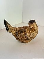 front and side view of ceramic bird figurine