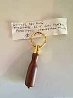 Key ring with note identifying swivel, rosewood, 24K gold