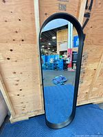 Front view of arched full-length mirror