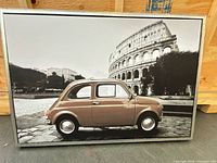 full view of framed canvas print showing vintage car and Colosseum