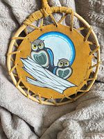 Front view showing painted owl scene and hoop construction