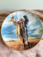 Front of the plate showing full artwork and gold rim