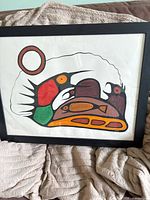 Frontal view of framed artwork showing entire composition and frame