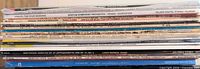 Side view of stacked LP spines showing titles and labels