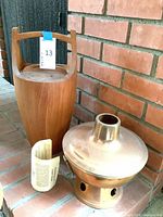 Teak vase, copper hot pot with lid, instruction sheet overall view