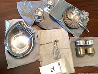 Group shot of all silver and sterling pieces on cloths