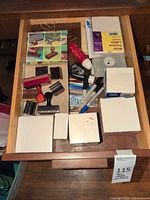 Drawer with stamps, ink pads, markers, Post-it cubes, small boxes