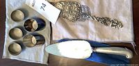 Overview showing five visible rings, decorative pie server, cake server in sleeve